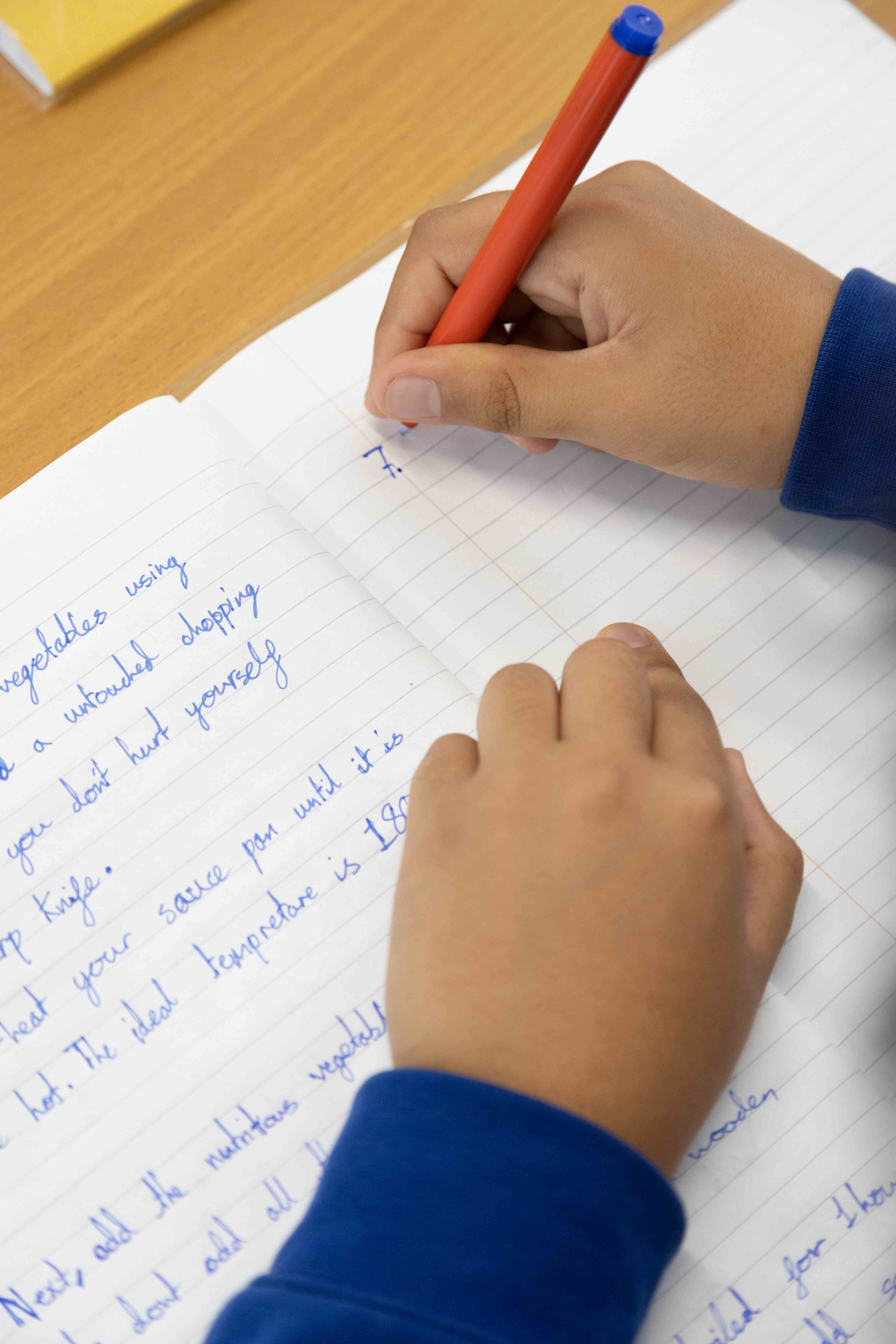 child hands writing 